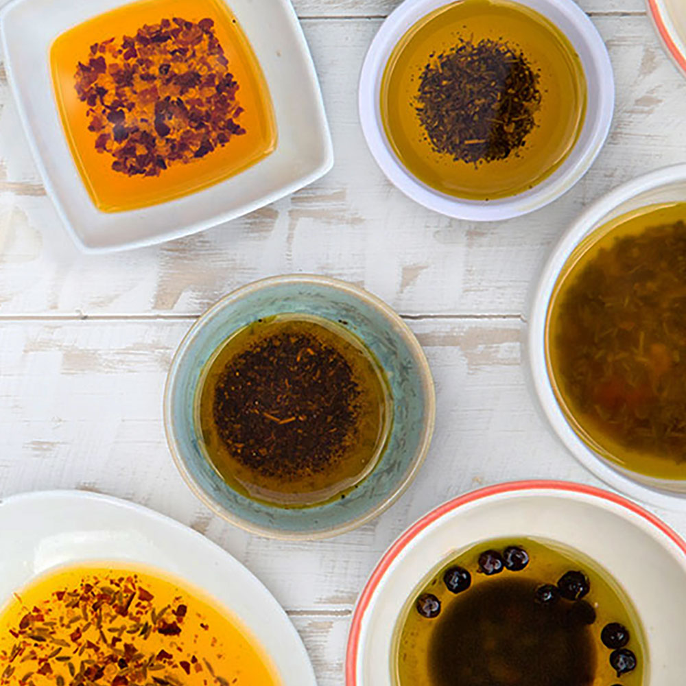 A selection of dipping oils in small bowls